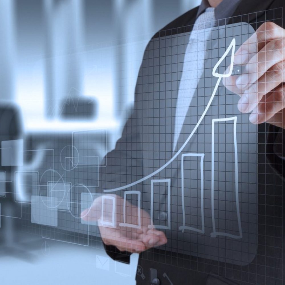 businessman hand working with new modern computer and business strategy as concept